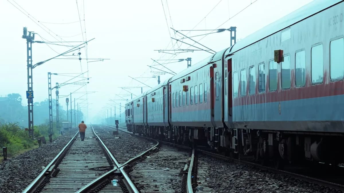 Indian train passing through a scenic landscape, representing fast and efficient travel.